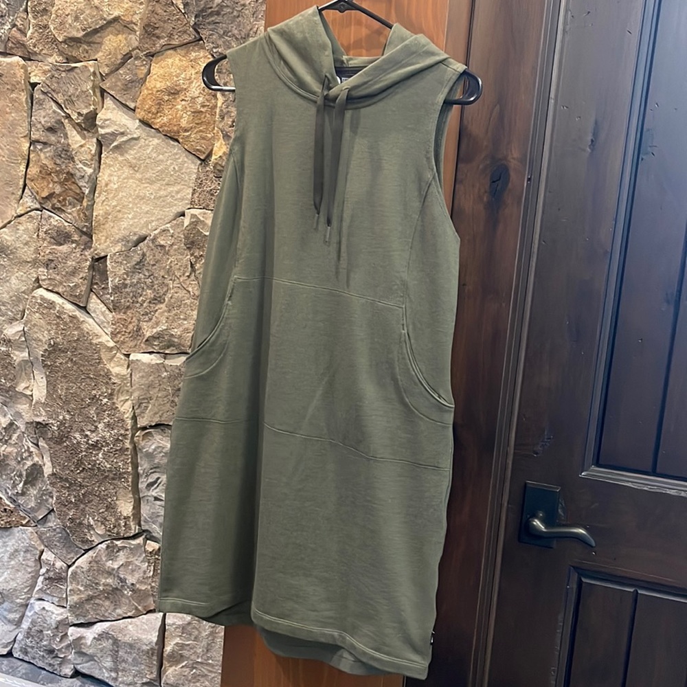 Long short sleeve pullover vest.
